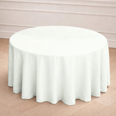 Round white tablecloth draped on a circular table.