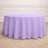 Round lavender tablecloth on a wooden floor.
