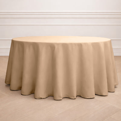 Beige round tablecloth draping elegantly over a table.