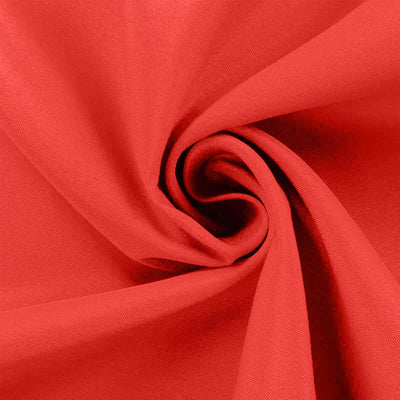Red fabric in a spiral pattern, showcasing smooth texture and vibrant color.