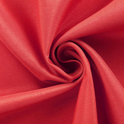 Red fabric texture in a swirling pattern.