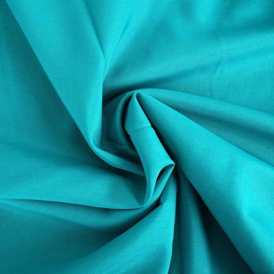 Teal fabric draping with soft texture and folds.