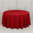 Round table with red tablecloth on a white backdrop