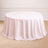 Round pink tablecloth draping elegantly over a circular table.