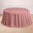 Round pink tablecloth draped elegantly over a table.