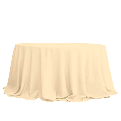 Round beige tablecloth with elegant draping fabric.