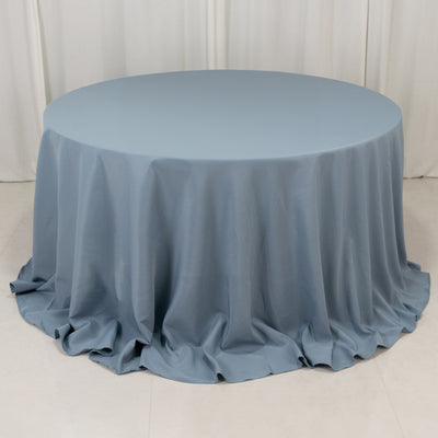 Round blue tablecloth draped elegantly over a table