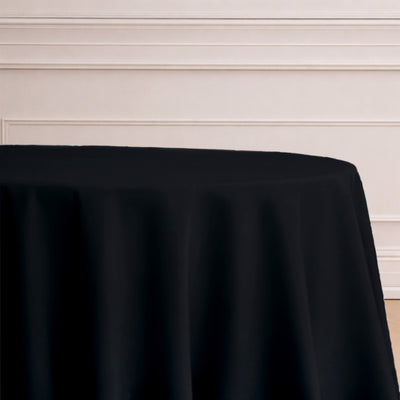 Black tablecloth draped elegantly over a round table.