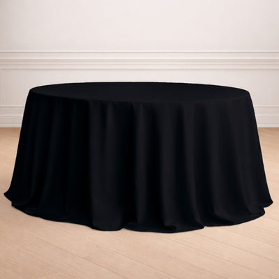Black round tablecloth draping elegantly over a table.