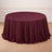 Round burgundy tablecloth draped elegantly over a table