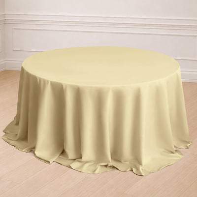 Round yellow tablecloth draped elegantly over a table in a bright setting.