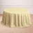 Round yellow tablecloth on a wooden floor.