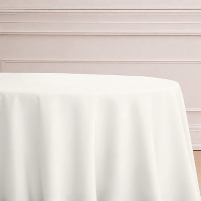 White tablecloth draping elegantly over a round table
