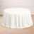 Round white tablecloth draped over a table in a styled setting.