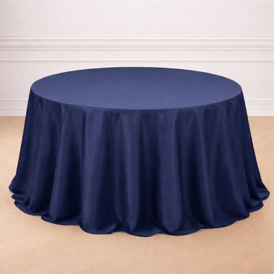 Navy blue round tablecloth draping elegantly over a circular table.