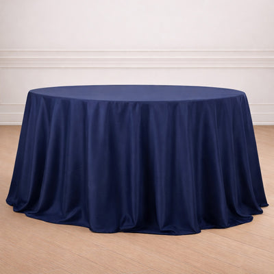 Navy round tablecloth draping elegantly over a circular table.
