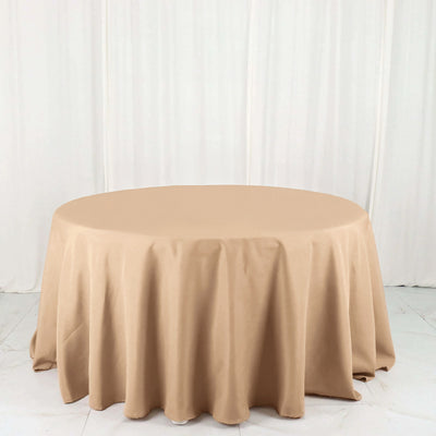 Round beige tablecloth draped elegantly over a table