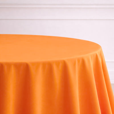 Orange round tablecloth on a white background.