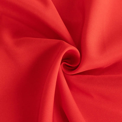 Red fabric texture in a swirling pattern.