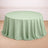 Round mint green tablecloth with elegant draping.