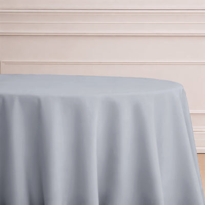 Gray tablecloth draped elegantly over a round table.