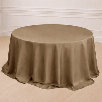 Brown round tablecloth draped elegantly over a table with decorative elements.