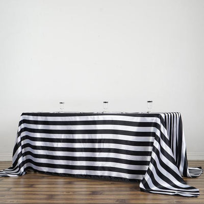 Black and white striped tablecloth draped over a table.