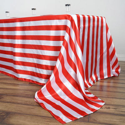 Red and white striped tablecloth on a wooden floor.