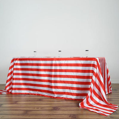 Red and white striped tablecloth on a wooden floor.