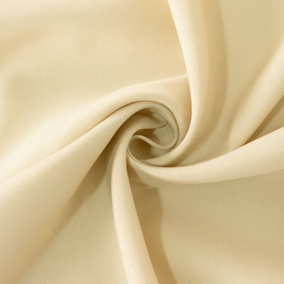 Beige fabric swirl showing smooth texture and drape. #whtbkgd
