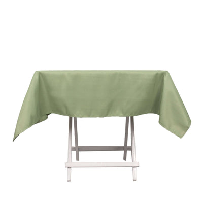 Green tablecloth on a white folding table