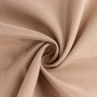 Beige textured fabric in a swirling pattern.