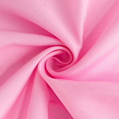 Pink fabric texture with a smooth, swirl pattern.