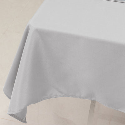 Gray tablecloth draping over a table edge.