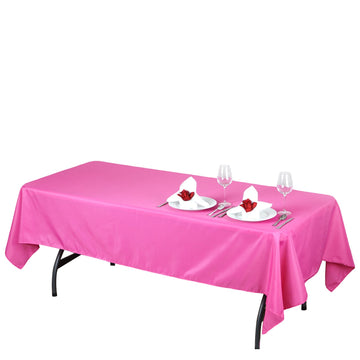 Add a Pop of Color to Your Event with the Fuchsia Seamless Polyester Rectangular Tablecloth 60"x102"