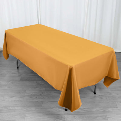 Yellow tablecloth draped over a table in a studio setting.