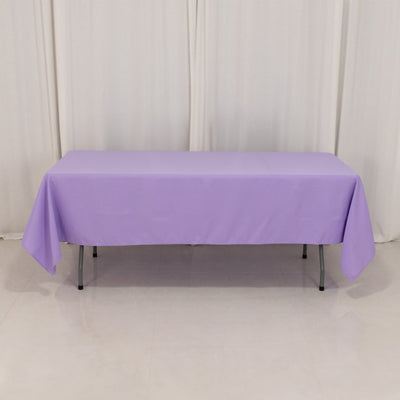 Purple tablecloth draped over a table in a studio setting.