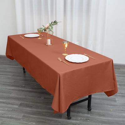 Brown tablecloth draped elegantly over a table set for dining.