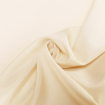 Beige satin fabric with elegant draping and smooth texture.