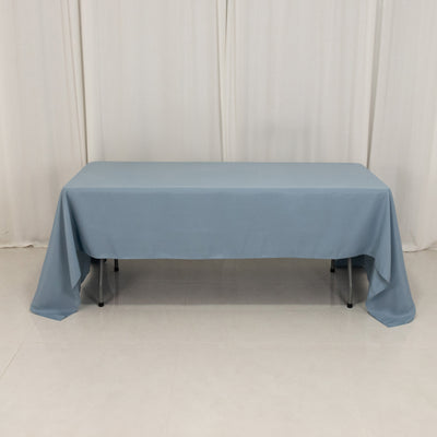 Blue tablecloth draped over a table in a studio setting.