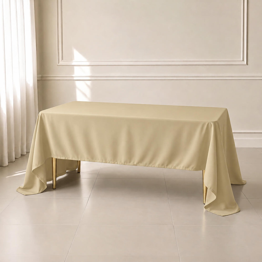 Champagne rectangle tablecloth 60"x126" - durable and wrinkle-resistant.