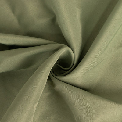Textured olive green fabric in a swirling pattern.
