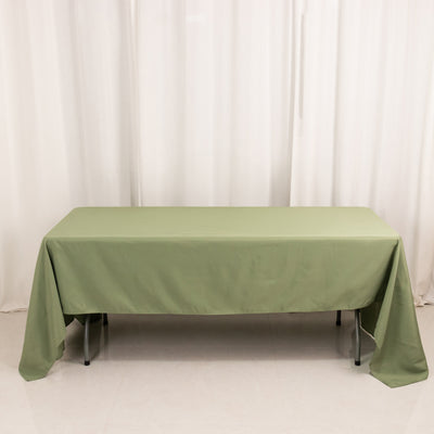 Green tablecloth draped over a table against a plain background