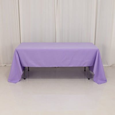 Purple tablecloth draped over a rectangular table.