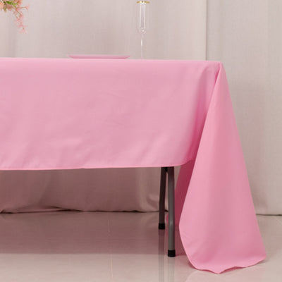 Pink tablecloth draped elegantly over a table in a soft setting.