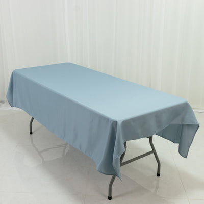 Light blue tablecloth draped over a folding table