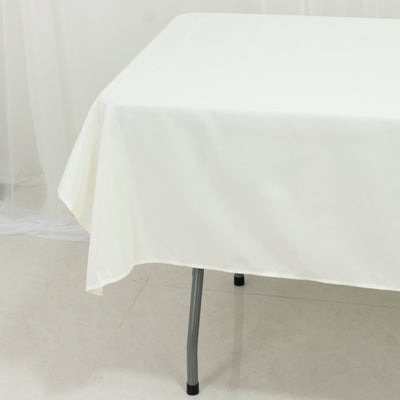 White tablecloth draped over a table with a plain background.