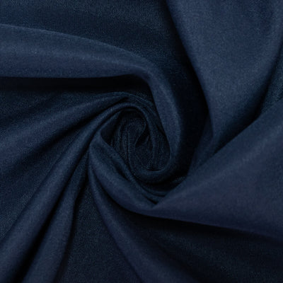 Navy blue fabric texture in a swirl pattern. #whtbkgd