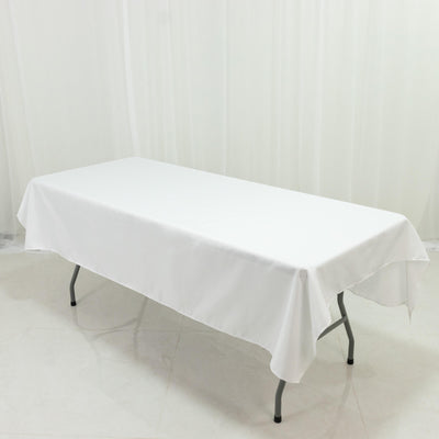 White table with a tablecloth, showcasing a clean and simple design.