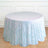 Iridescent sequin tablecloth on a round table in a bright, airy setting.
